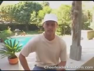 Adorable sexy superb blonde cheerleader talking with the coach